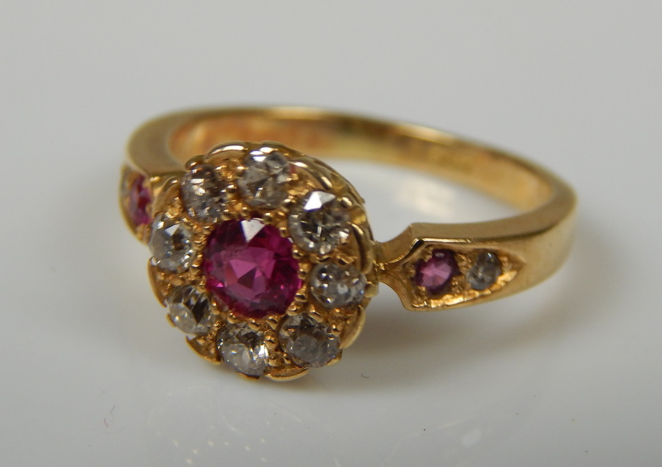 Appraisal: A ruby and diamond floral dress ring the central ruby