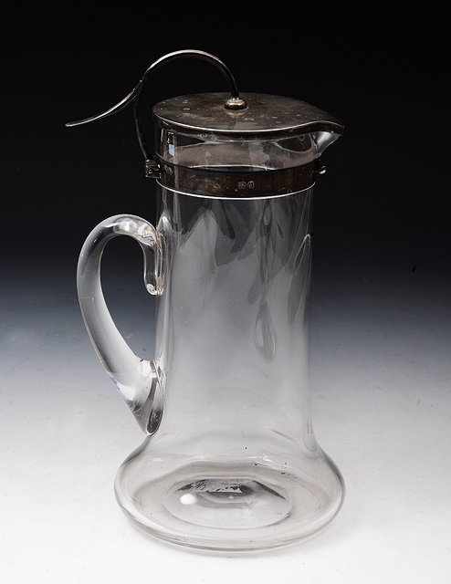 Appraisal: A SILVER MOUNTED GLASS CORDIAL JUG of twisted form and