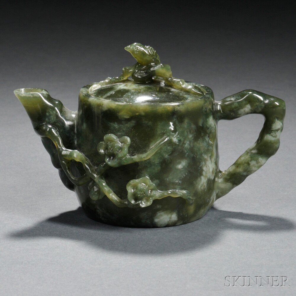 Appraisal: Miniature Stone Covered Teapot China carved in relief with flowering