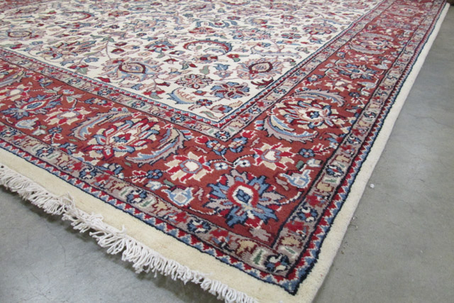 Appraisal: HAND KNOTTED ORIENTAL CARPET Indo-Persian overall floral design on cream