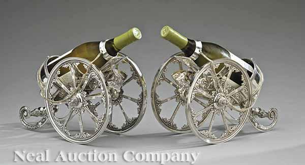 Appraisal: A Pair of Decorative Silverplate Cannon-Form Wine Trolleys length in