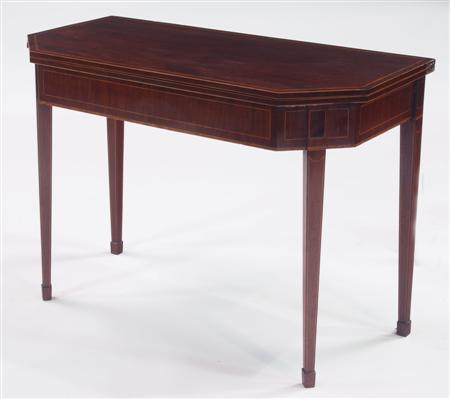 Appraisal: A George III mahogany and inlaid foldover tea table the