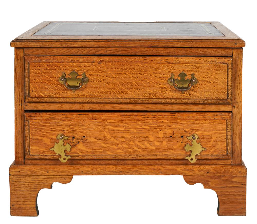 Appraisal: SMALL LEATHER-INSET OAK TWO-DRAWER CHESTwith brass handles Condition missing two