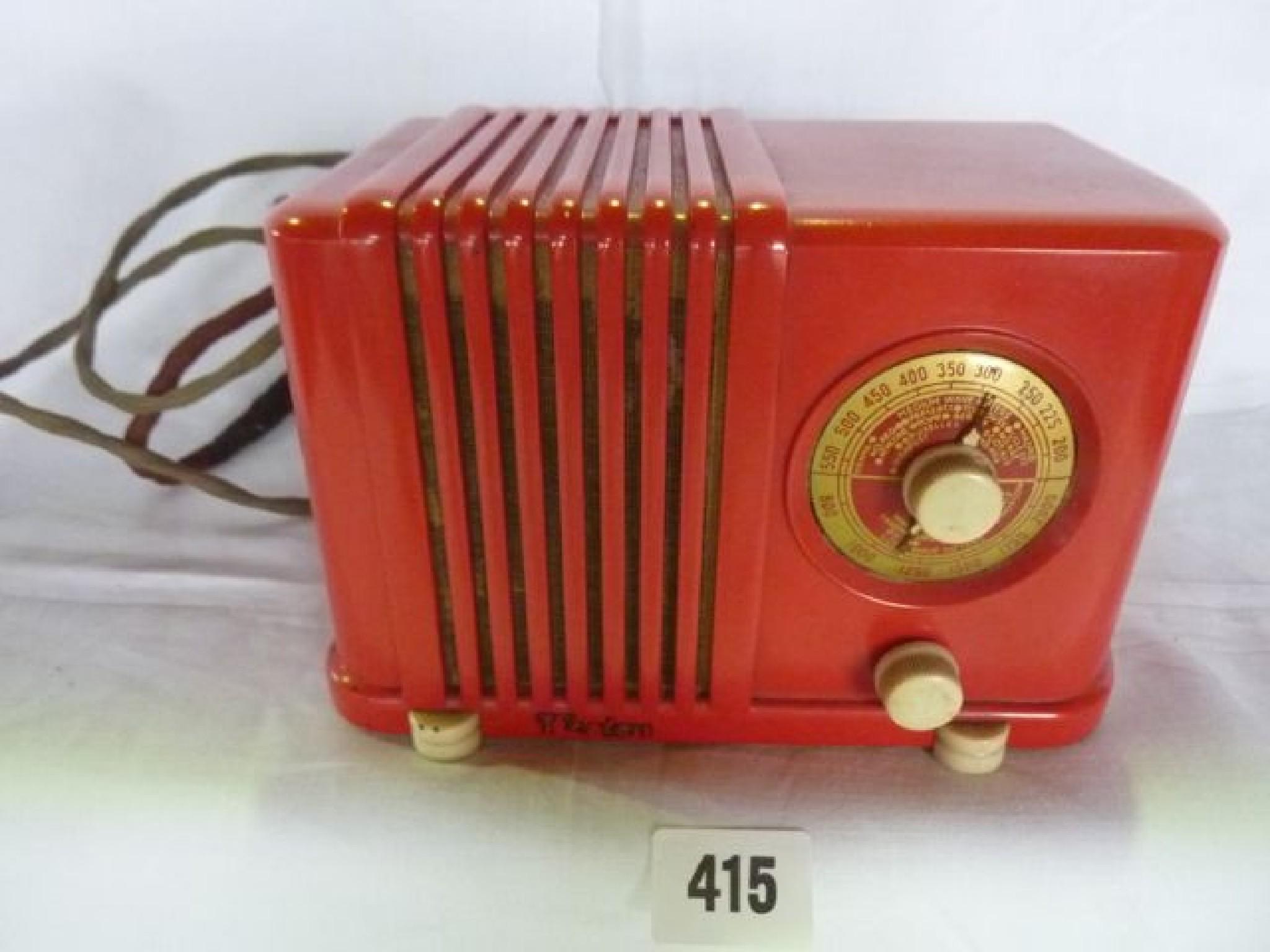 Appraisal: A small vintage mains radio in a bright red plastic