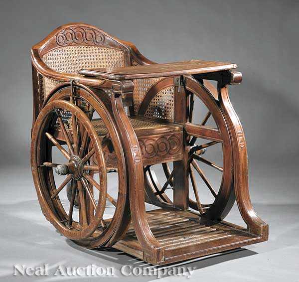 Appraisal: An Italian Carved Walnut and Caned Invalid's Wheelchair late th