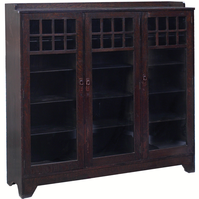 Appraisal: Lifetime bookcase three doors with divided glass at top over