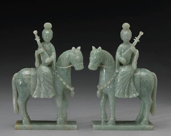 Appraisal: A pair of pale green jadeite female musicians on horseback