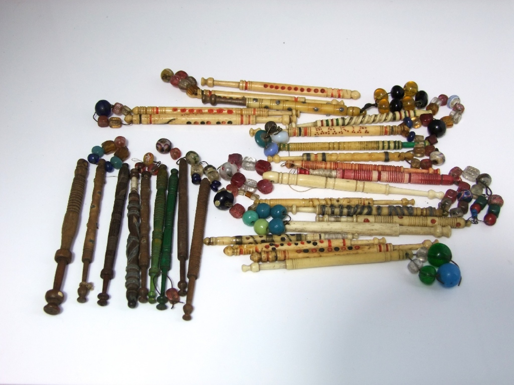 Appraisal: A collection of th century bobbins in timber in bone