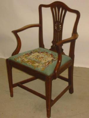 Appraisal: A GEORGE III MAHOGANY ELBOW CHAIR of Hepplewhite type arched