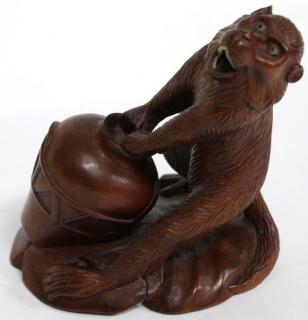 Appraisal: Chinese Hardwood Sculpture of a Monkey The carved animated figure