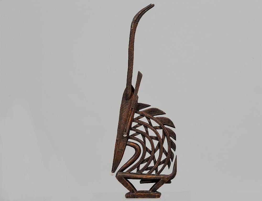 Appraisal: AFRICAN TRIBAL WOOD CHIWARA BANANA ANTELOPE Mounted on a Lucite