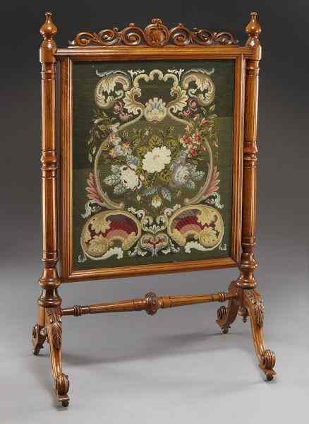 Appraisal: Victorian framed needlepoint firescreensupported by turned and paneled columns on