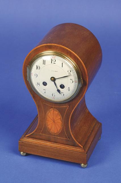 Appraisal: AN EDWARDIAN BALLOON SHAPED MANTEL CLOCK the white enamelled dials