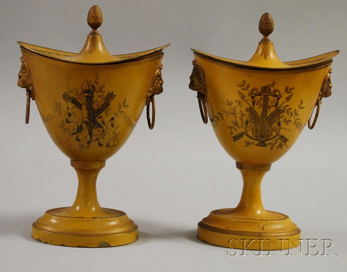 Appraisal: Pair of French Paint-decorated Metal Chestnut Urns with Covers ht