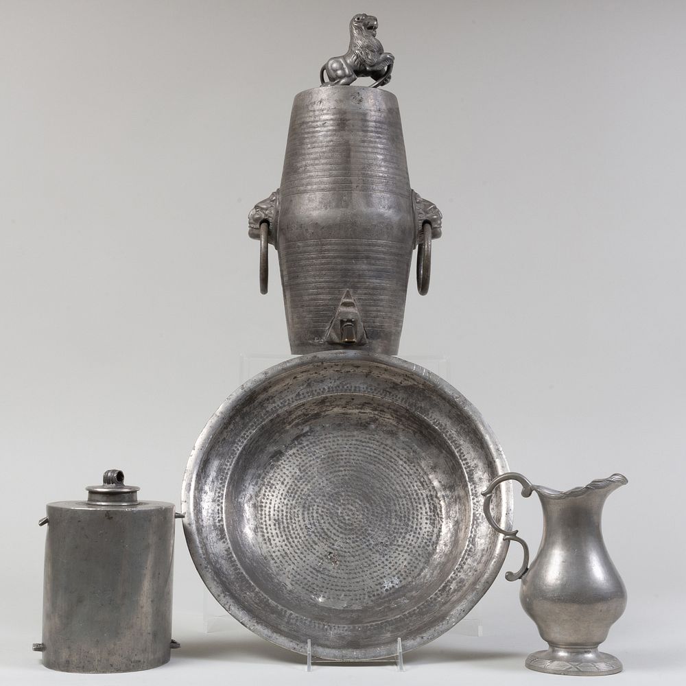 Appraisal: Three Pewter Vessels and a Charger Comprising A baroque style