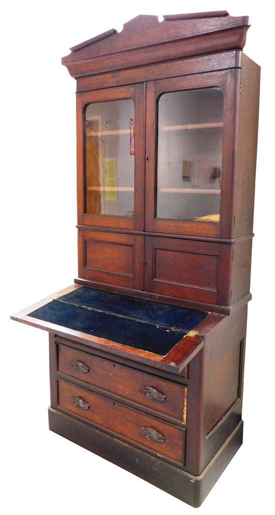 Appraisal: Victorian two-piece bookcase desk mahogany projecting notched triangular pediment upper