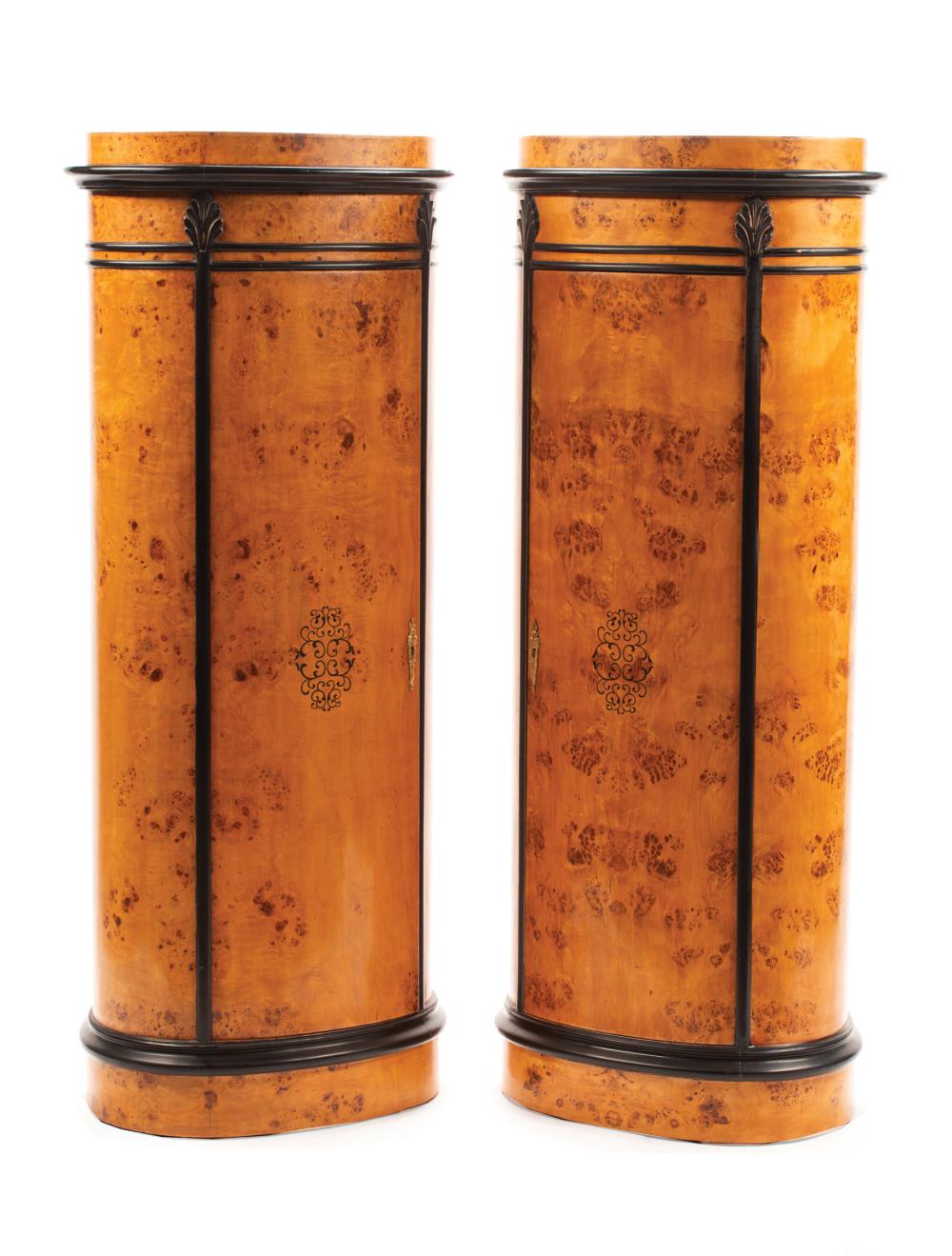 Appraisal: Pair of Charles X-Style Parcel Ebonized Burlwood Pedestal Cabinets oval