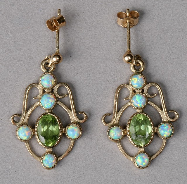 Appraisal: A PAIR OF PERIDOT AND OPAL EARRINGS of scrolled form