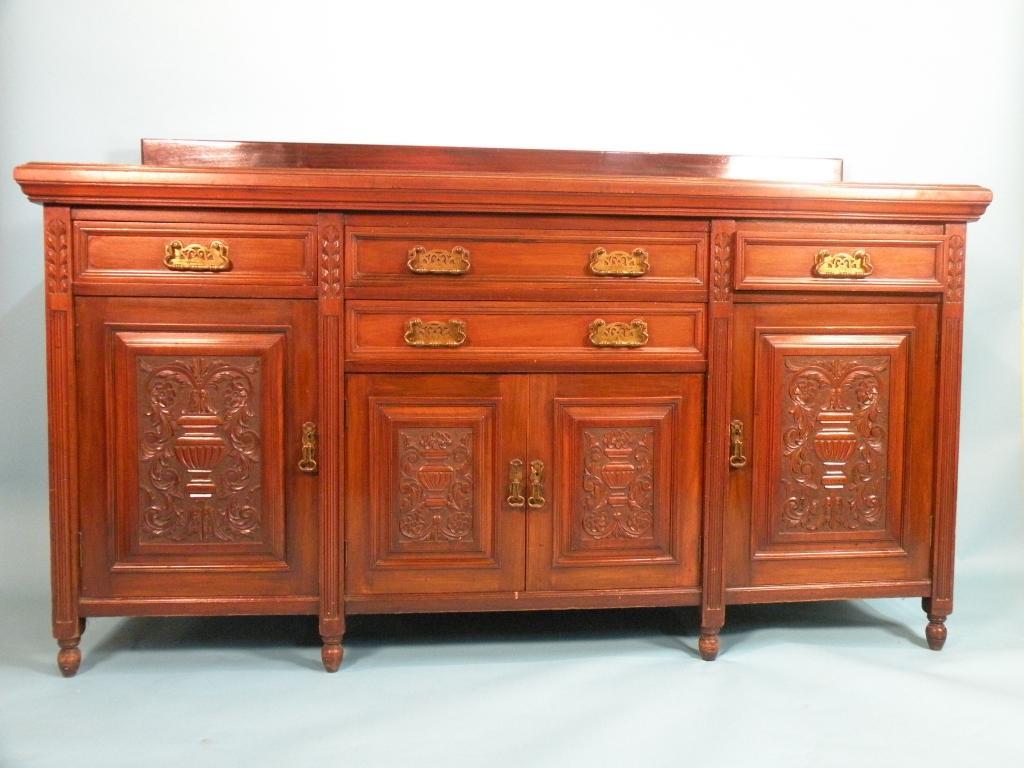 Appraisal: A Victorian walnut sideboard with an arrangement of four drawers