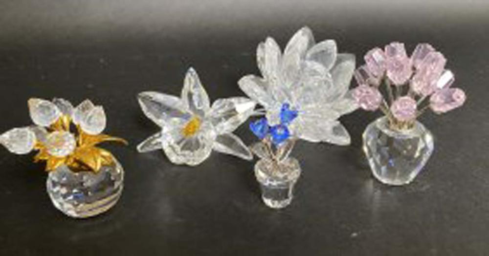 Appraisal: FIVE SWAROVSKI CRYSTAL FLORAL GROUPSSigned Including three flower-filled vases with