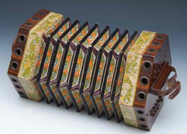 Appraisal: AN OLD CONCERTINA the foliate and bird decorated bellows marked