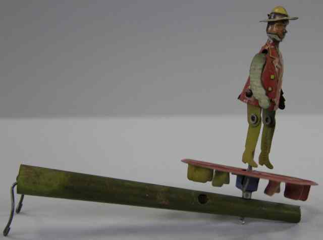 Appraisal: DANCING MAN WHISTLE PENNY TOY Germany lithographed tin dancing figure