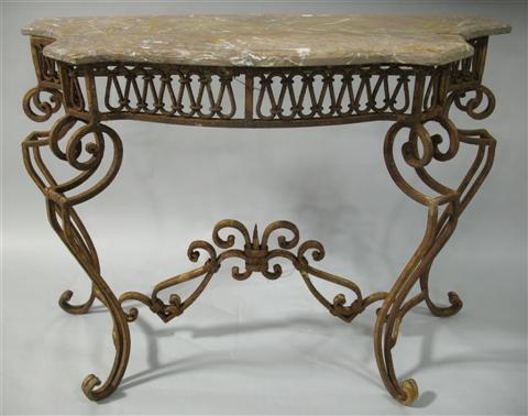 Appraisal: WROUGHT IRON AND PINK MARBLE TOP GARDEN TABLE The shaped