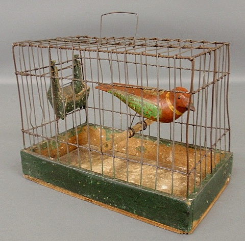 Appraisal: - Folk art carved and polychrome decorated bird in a