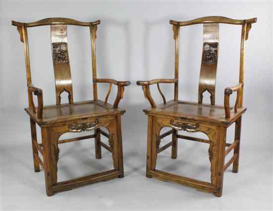 Appraisal: A pair of Chinese elm provincial armchairs with carved splats