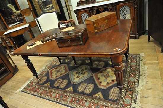 Appraisal: A VICTORIAN CEDAR EXTENDING DINING TABLE ON TURNED AND FLUTED