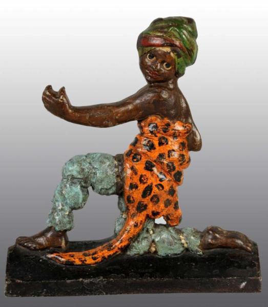 Appraisal: Cast Iron Jungle Boy Doorstop Description Depicts jungle boy in