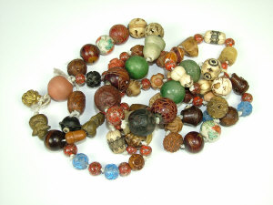 Appraisal: A Chinese bead necklace Strung with various carved hard stone