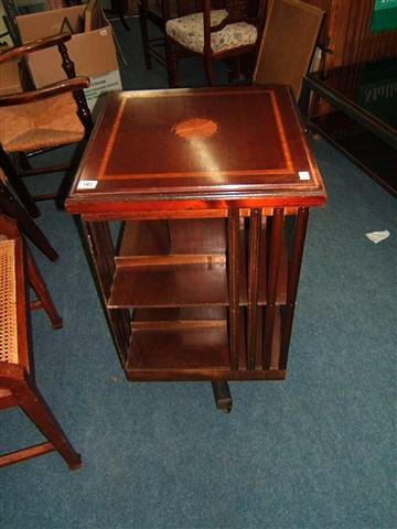 Appraisal: An Edwardian style mahogany revolving bookcase the top square x