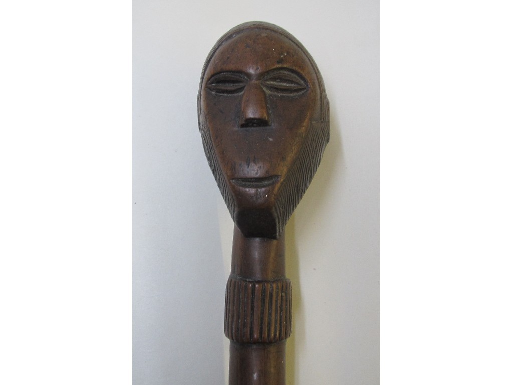 Appraisal: An African hardwood club carved with a man's head above