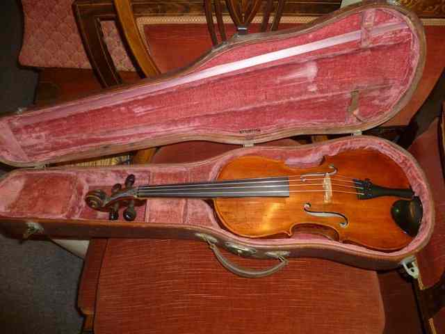 Appraisal: A VIOLIN in calf skin travelling case with paper label