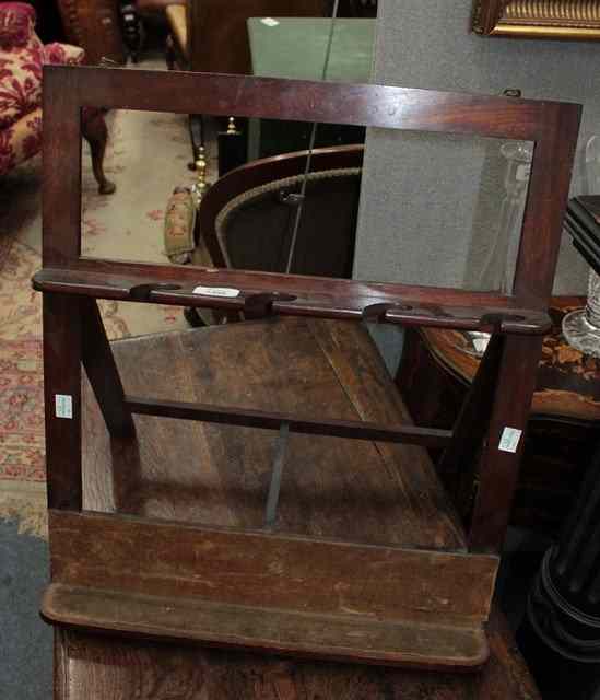 Appraisal: A MAHOGANY FOLDING INSTRUMENT RACK of triangular form with velvet