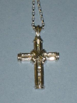 Appraisal: A DIAMOND CROSS in ct white gold channel set with