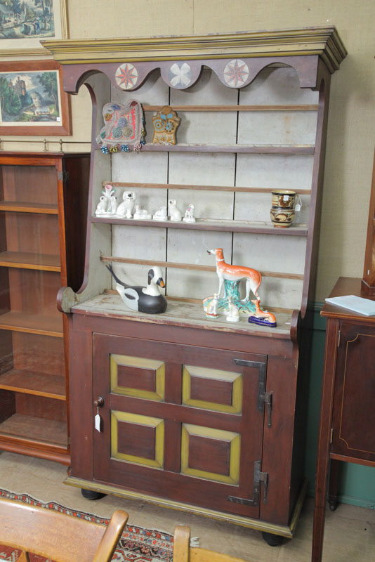 Appraisal: PEWTER CUPBOARD Folksy paint decorated cupboard with a molded cornice