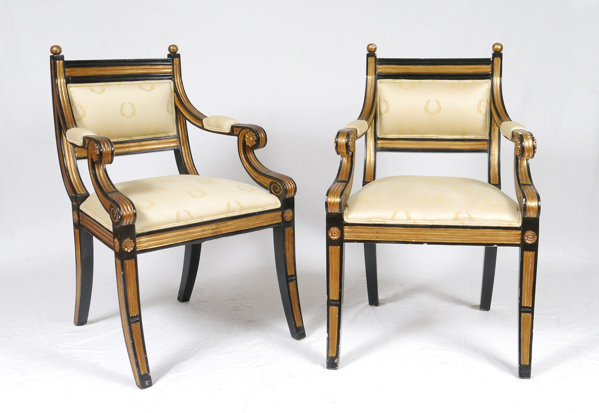 Appraisal: PAIR REGENCY STYLE ARMCHAIRS Black and gilt painted frames with