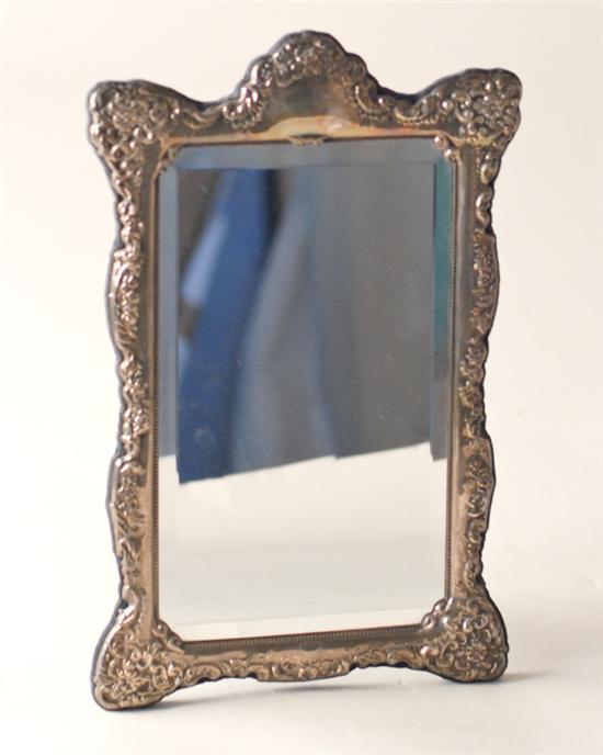 Appraisal: An English Sterling Easel-back Mirror having a repousseed frame with