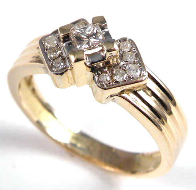 Appraisal: DIAMOND AND TEN KARAT GOLD RING centering a princess-cut diamond