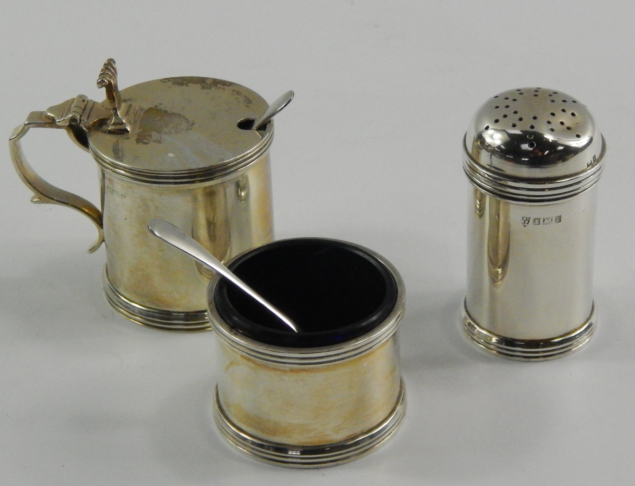 Appraisal: A silver three piece condiment set of barrel form with