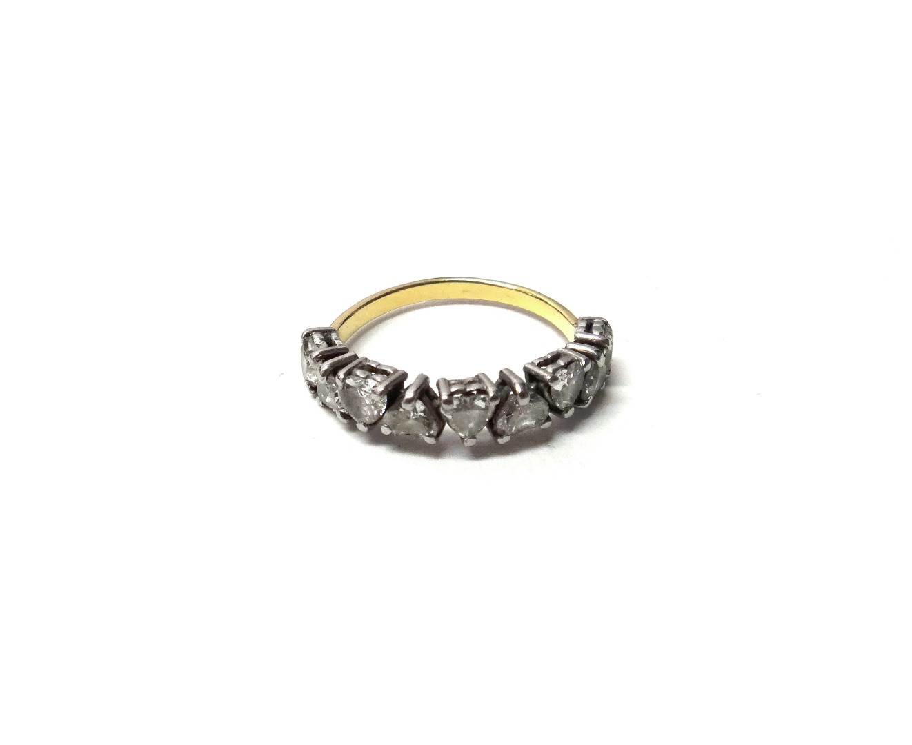 Appraisal: A gold and diamond set nine stone half hoop ring