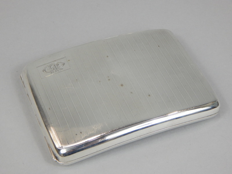 Appraisal: An Art Deco period engine turned silver cigarette case bearing