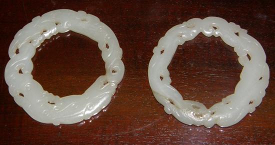 Appraisal: A PAIR OF CHINESE JADE RINGS each carved with a