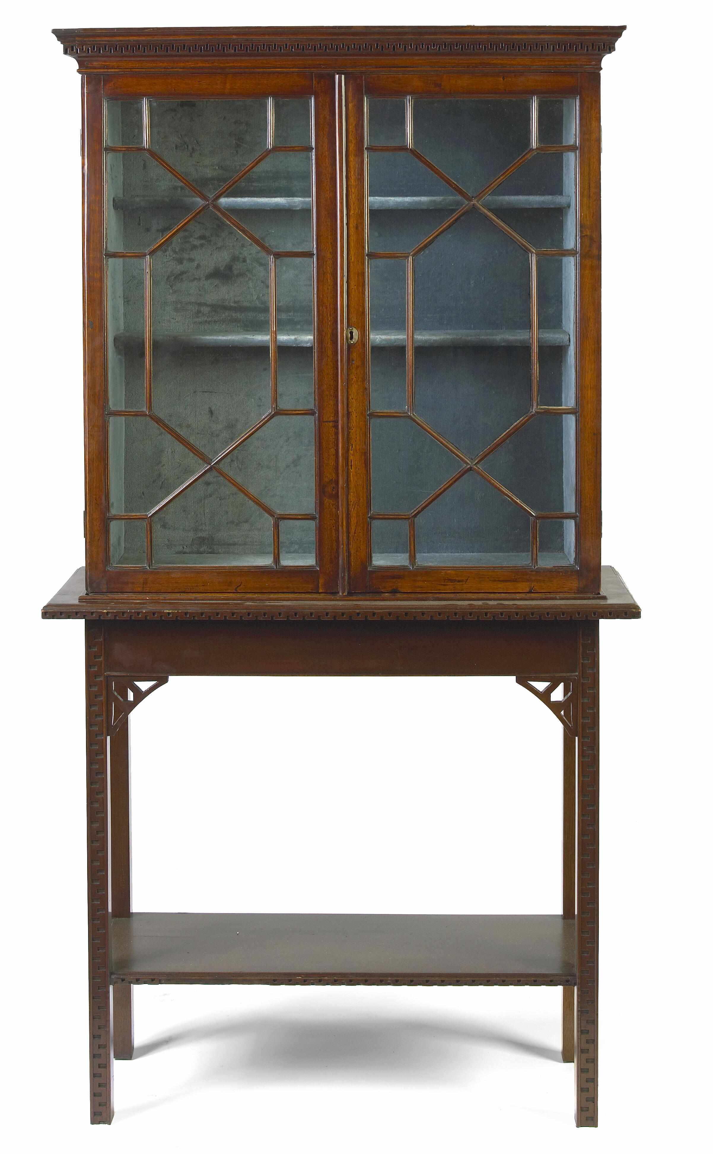 Appraisal: A George III mahogany bookcase on later stand late th