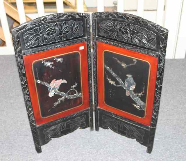 Appraisal: A MODERN CHINESE TWO FOLD HARDWOOD SCREEN with inlaid mother-of-pearl