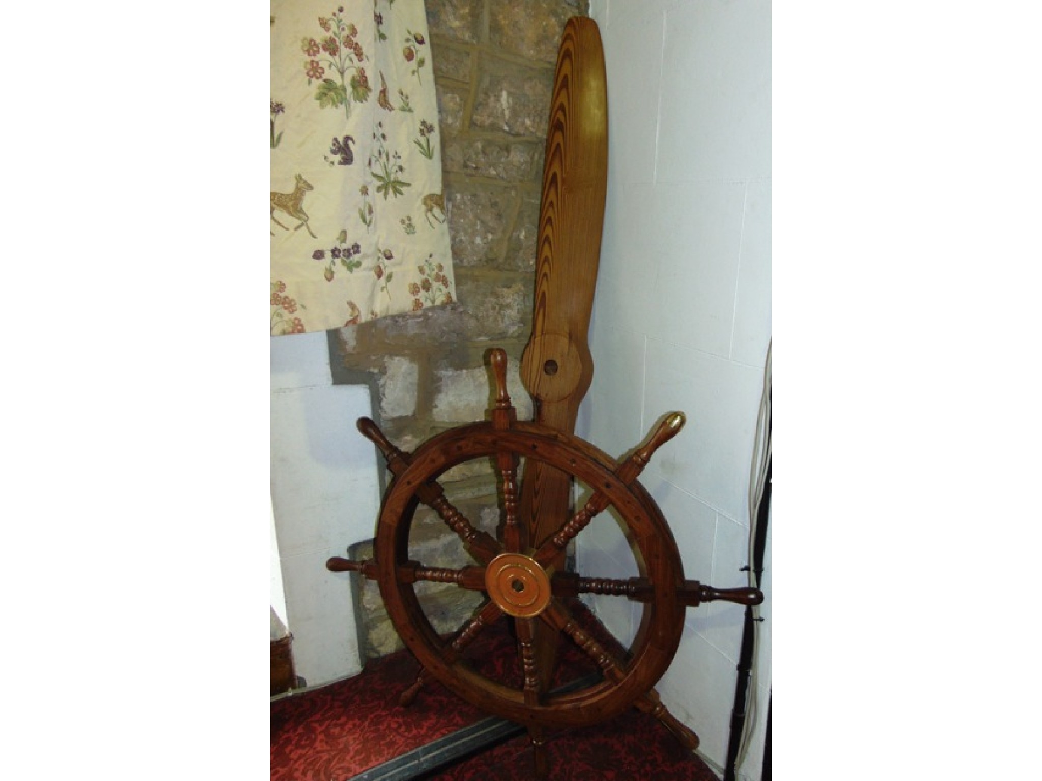 Appraisal: A large timber ships wheel with eight turned splats terminating