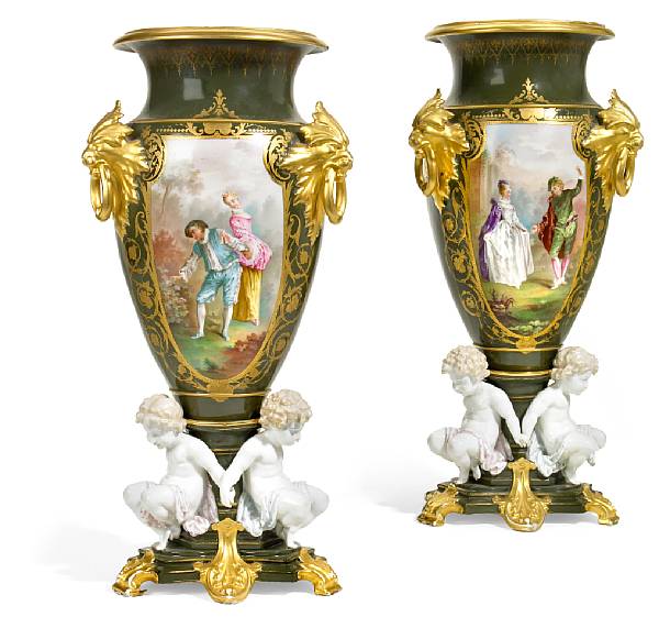 Appraisal: A pair of S vres style porcelain urns third quarter