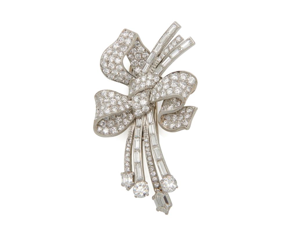 Appraisal: Platinum and Diamond Brooch the ribbon and spray-form brooch featuring